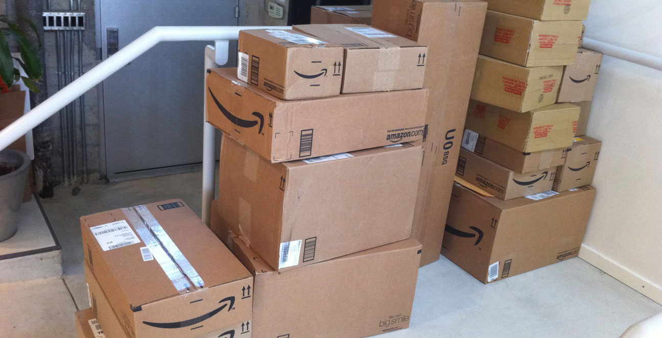 Stack of Amazon prime one-day shipping boxes