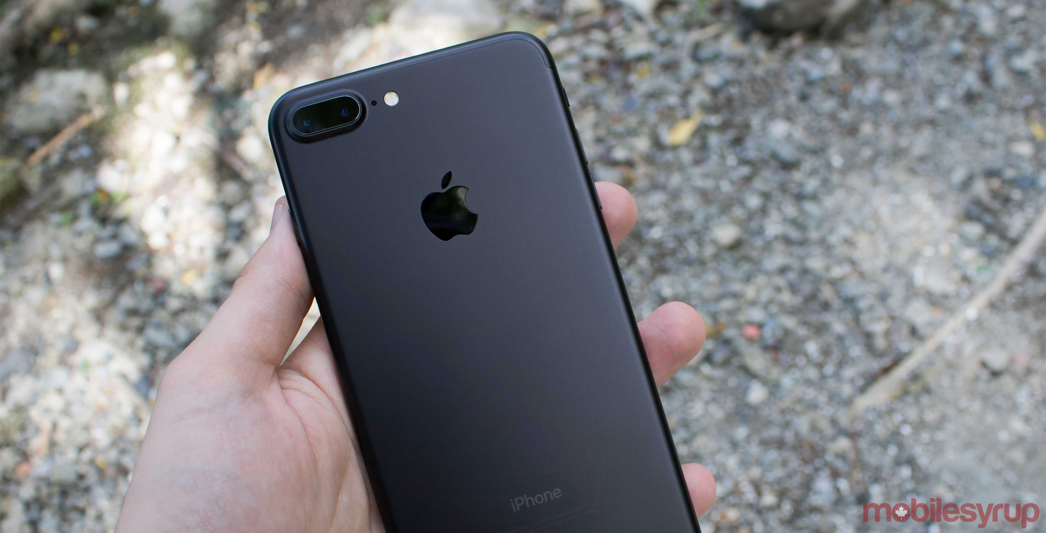 Apple iPhone 7 being held in a hand - Next could have OLED screen