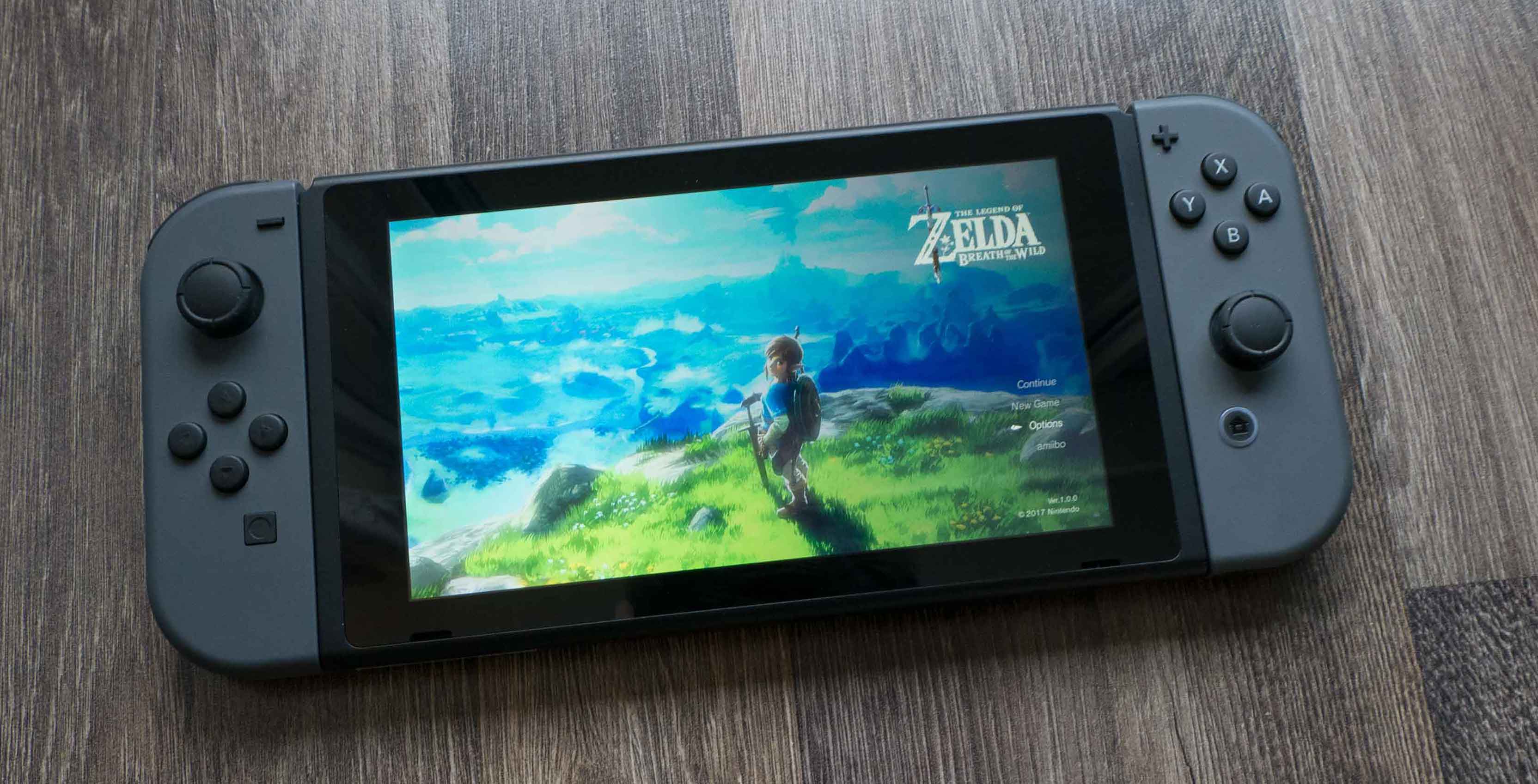 Nintendo Switch sitting on the ground with Joy-cons