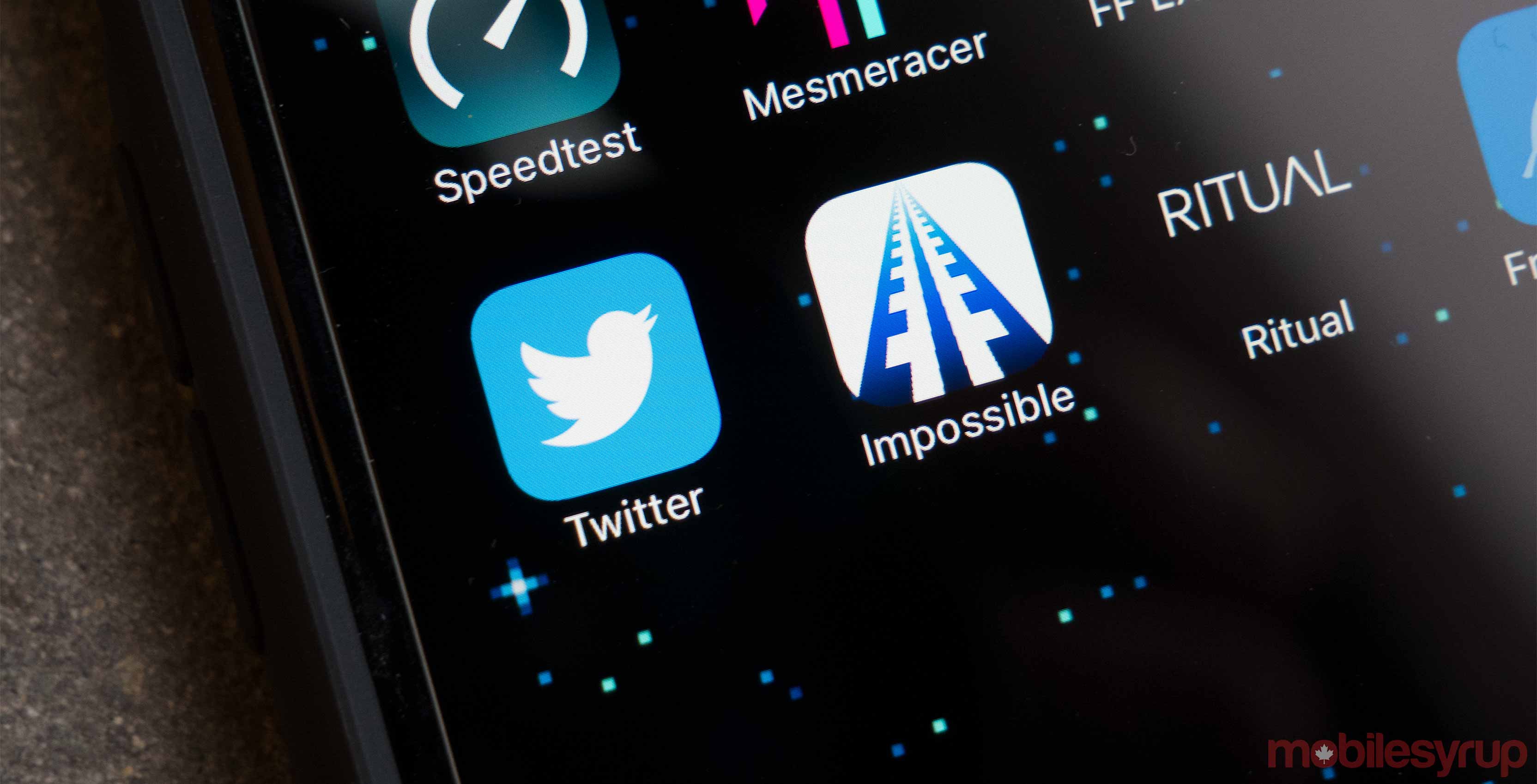 Twitter app on a phone - Twitter details new safety features that aim stop trolls harassment abuse