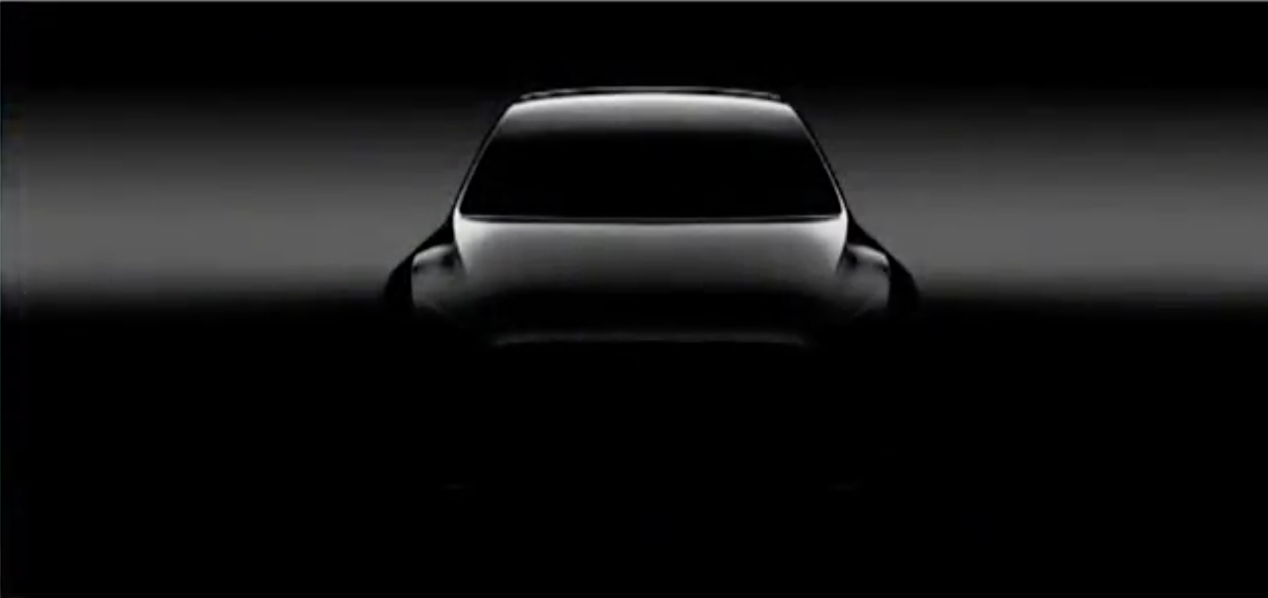 A shadowy image of Tesla's upcoming Model Y crossover SUV