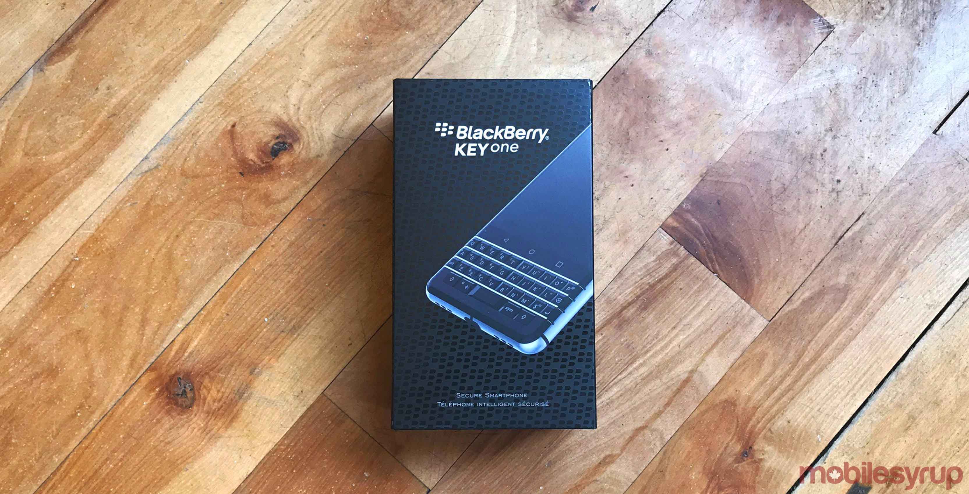 blackberry keyone box laying on hardwood floor