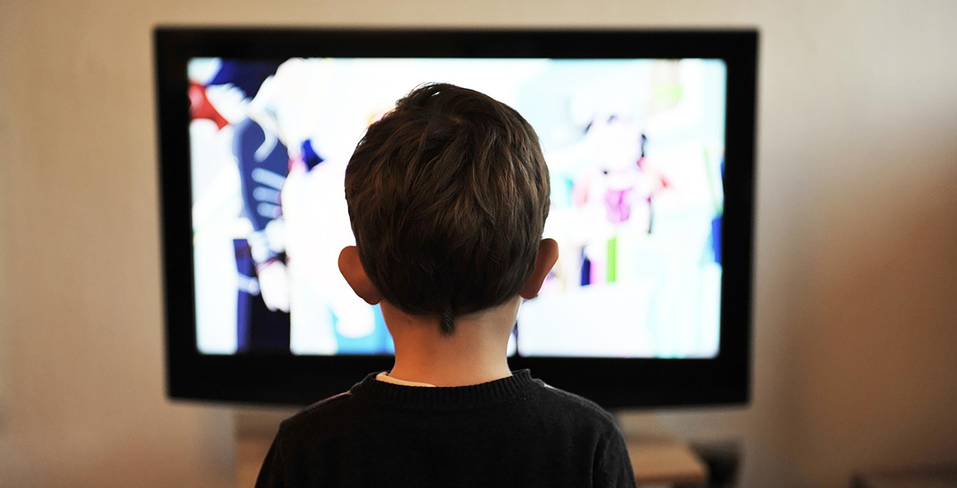 Child in front of screen