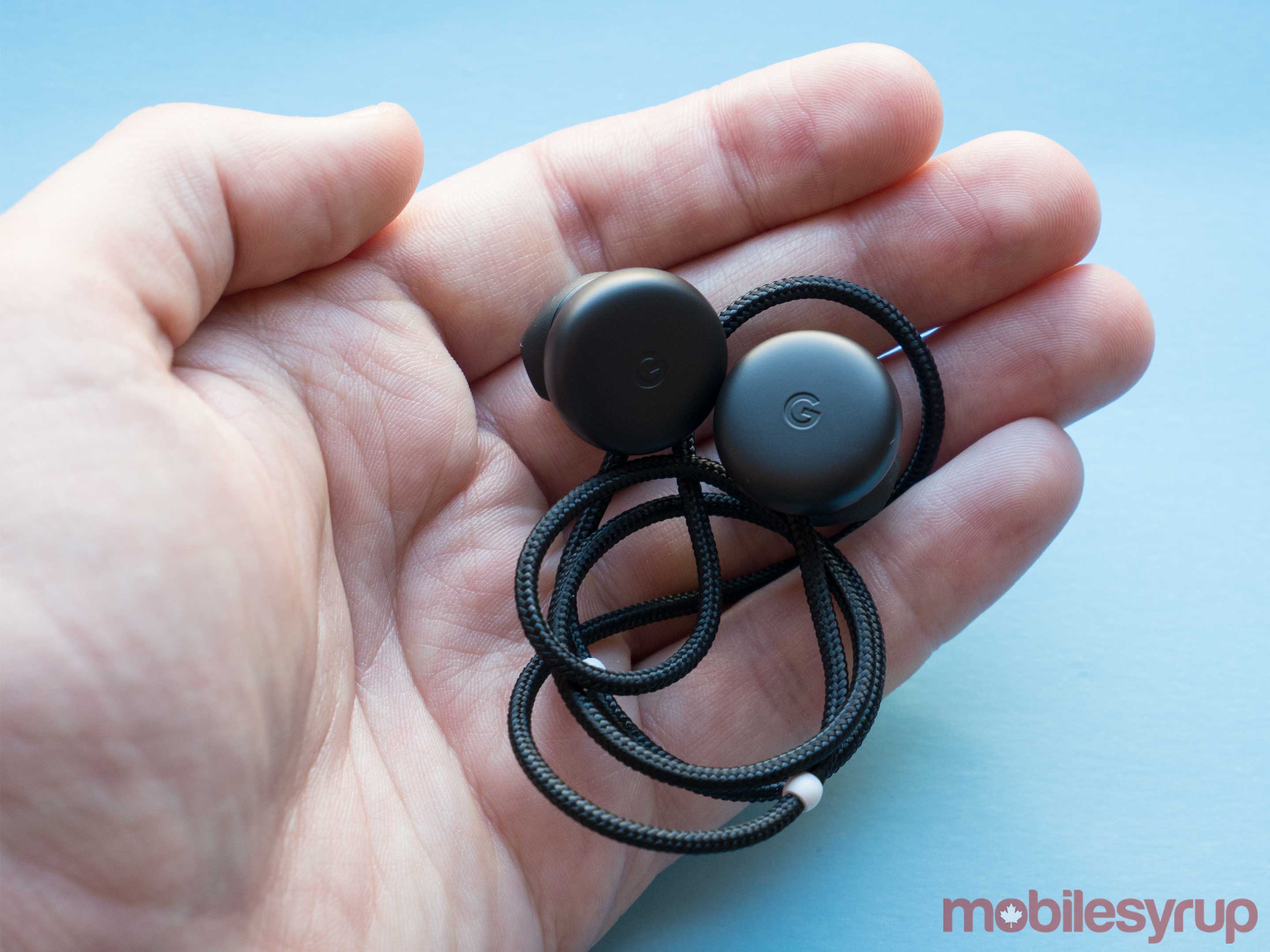 Pixel Buds sitting in a hand