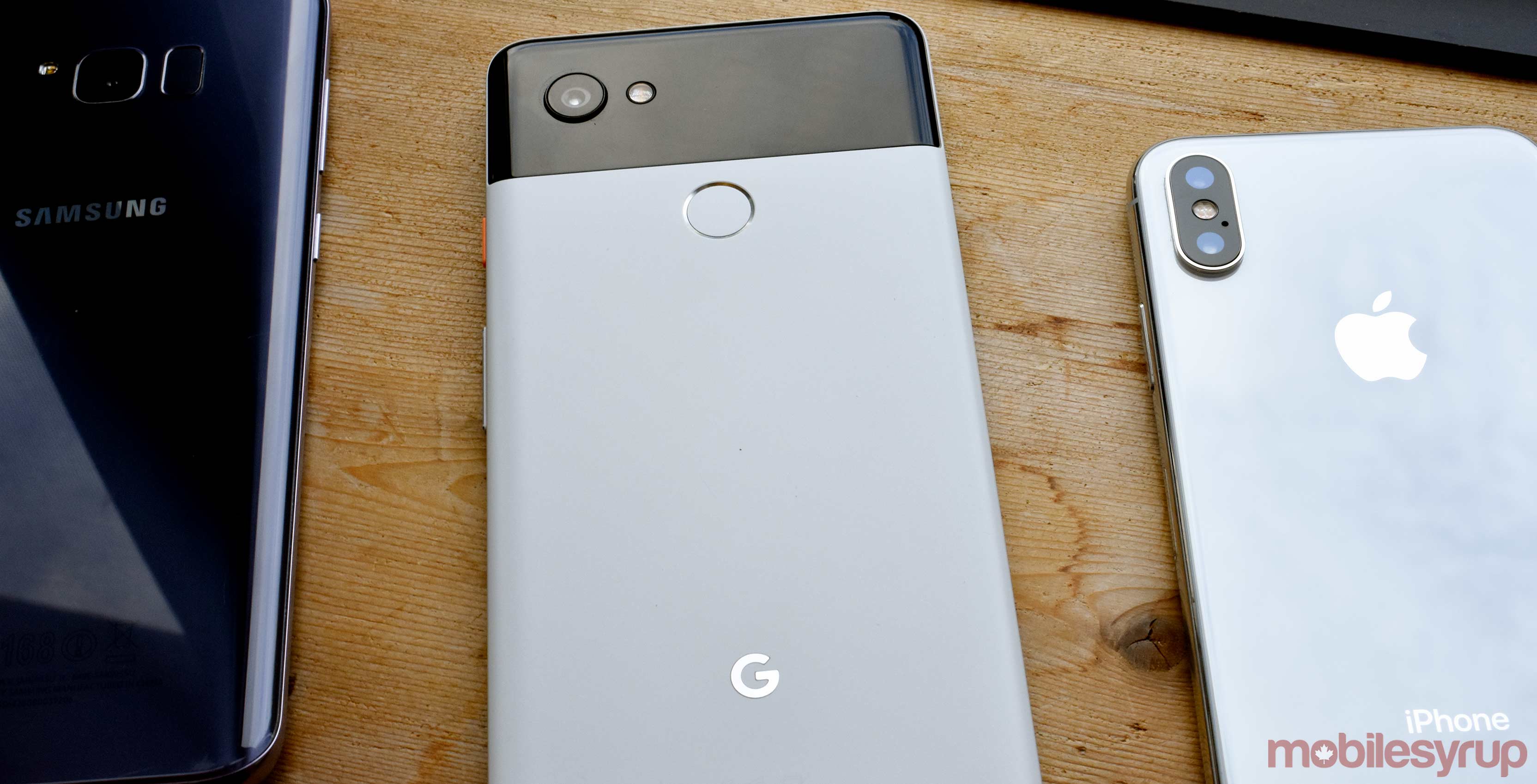 The Google Pixel 2 XL, Samsung S8 Plus and the iPhone X all beside one another
