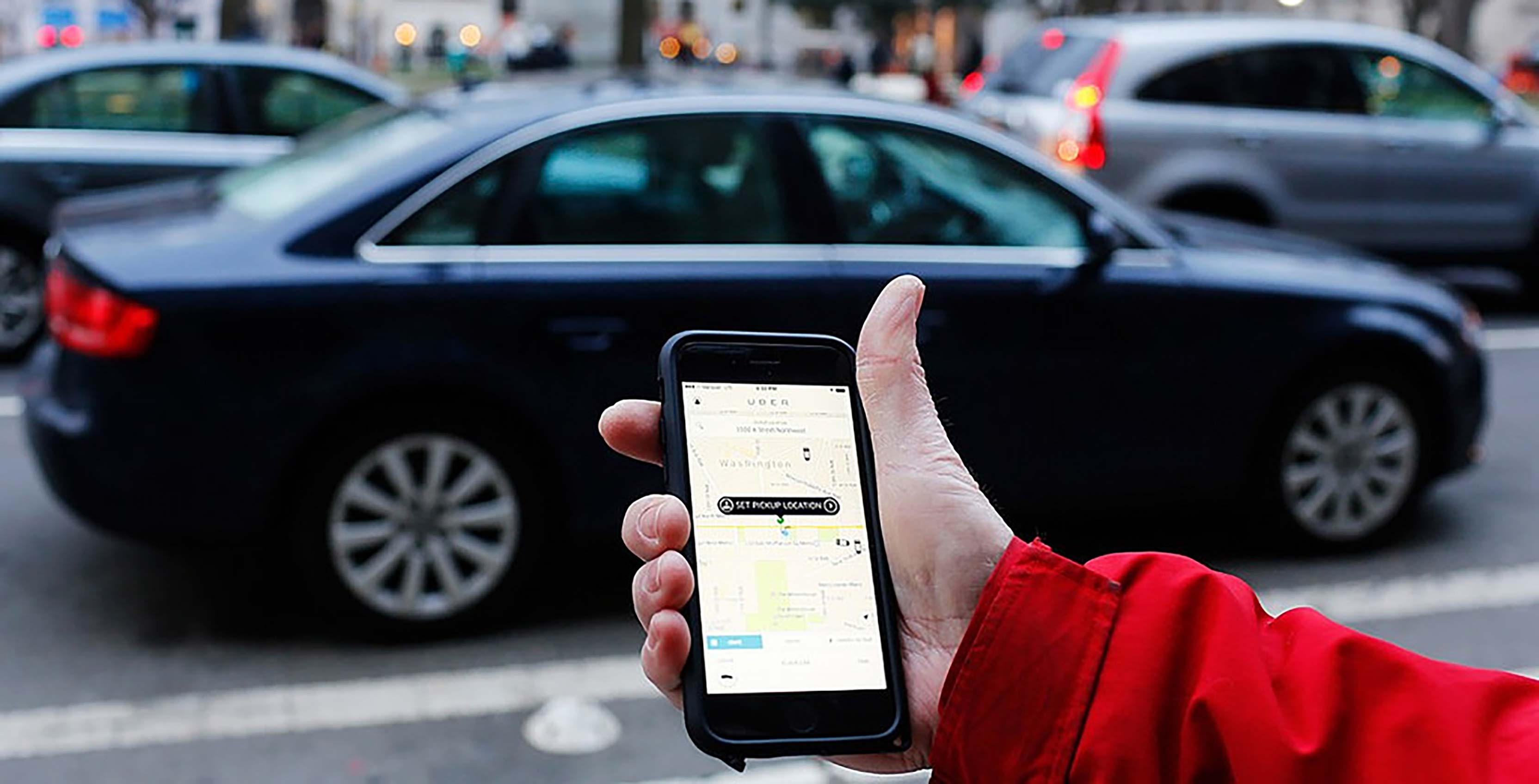 Uber app on phone car pickup