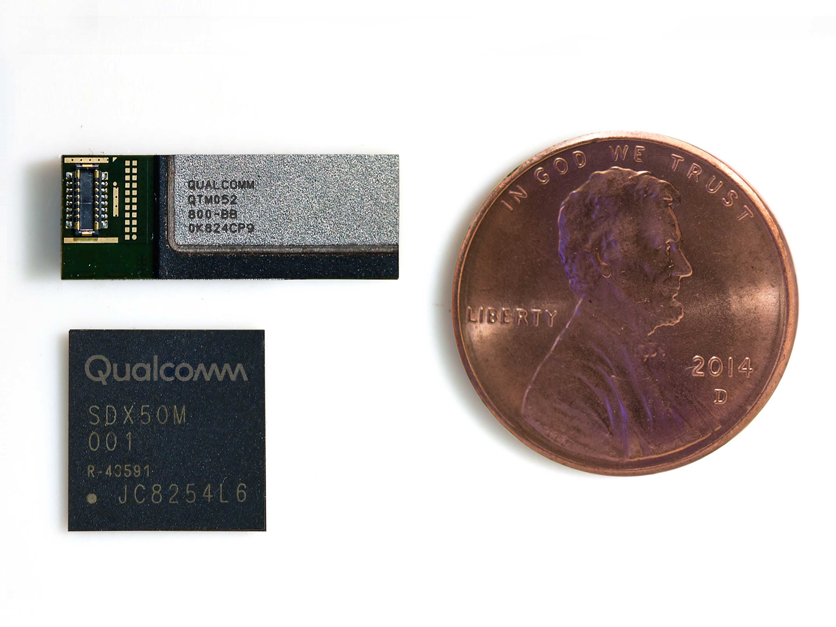 The size of the X50 modem and QTM052 antenna module compared to an American penny