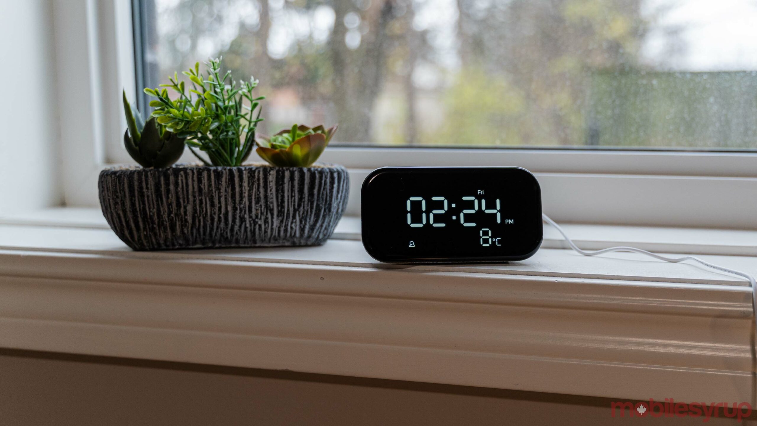 Lenovo Smart Clock Essential with a fake succulent