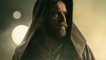 Ewan McGregor in Obi-Wan Kenobi. Obi-Wan is hooded and stares outward solemnly.