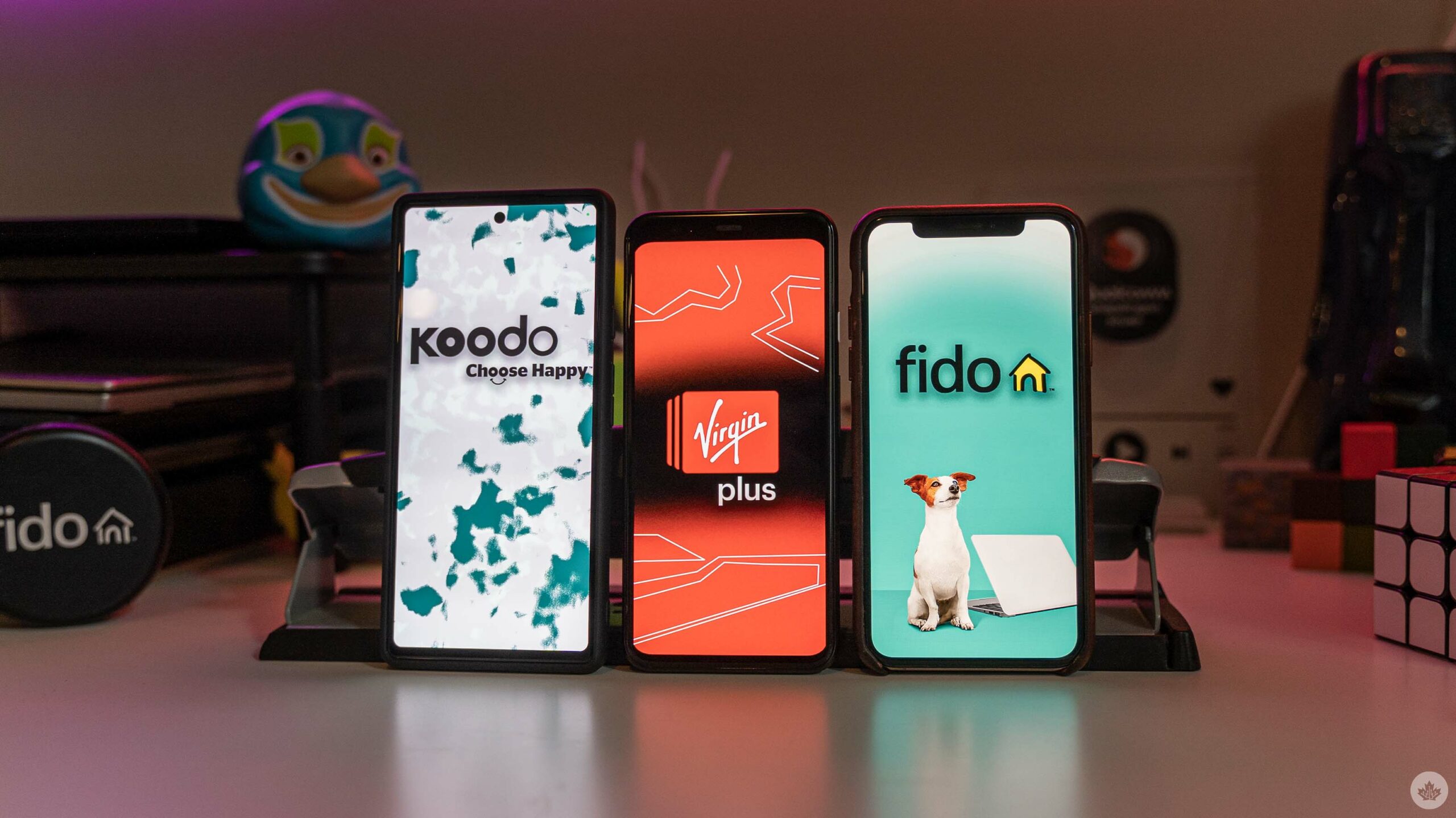 Koodo, Virgin Plus, and Fido logos on smartphones.