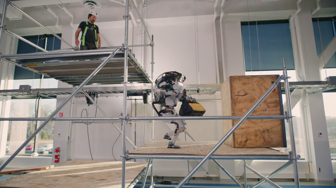 Watch Boston Dynamics’ Atlas fling a tool kit at a ‘construction site’