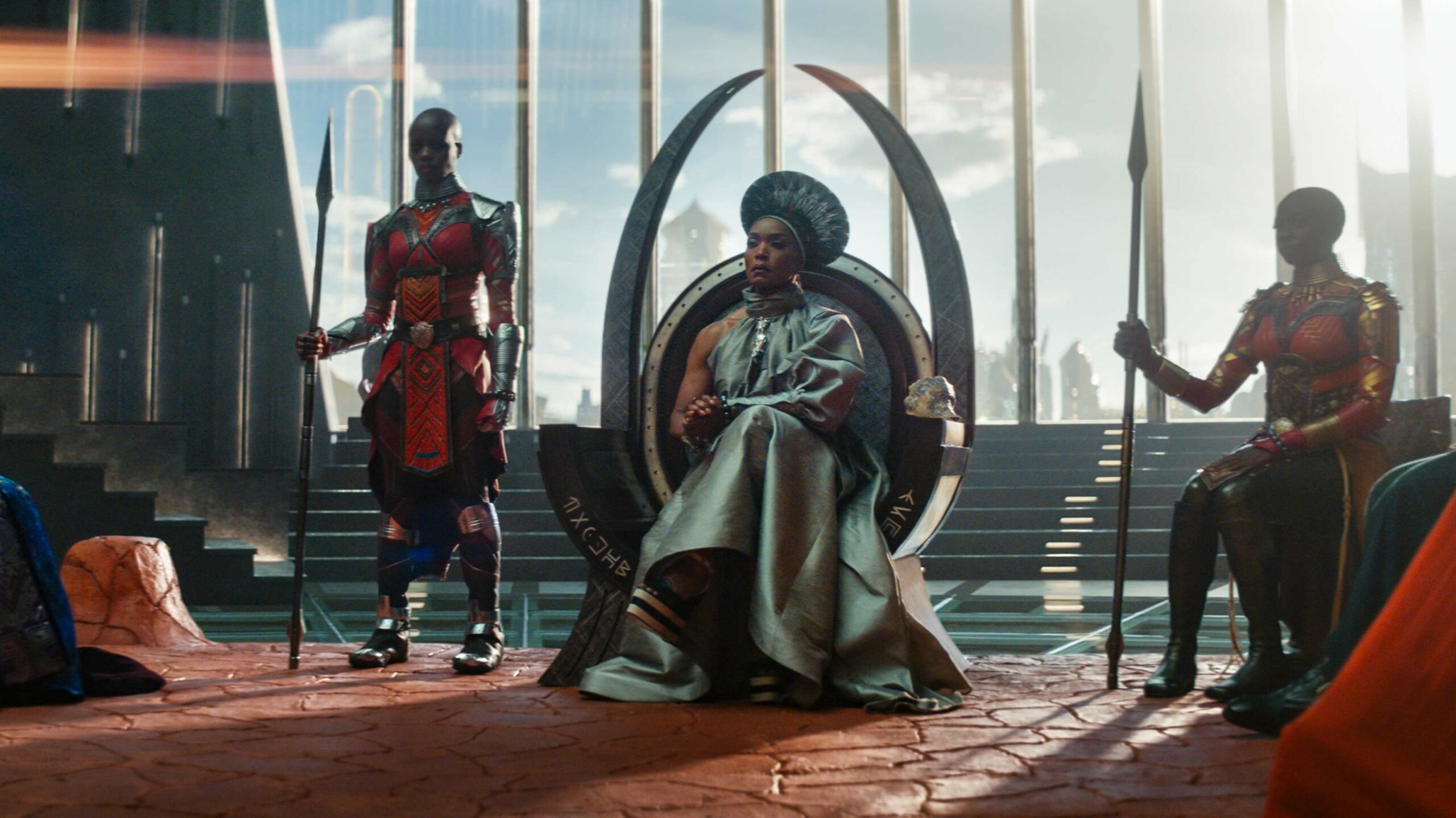 Queen Ramonda sits on the throne in Black Panther: Wakanda Forever.