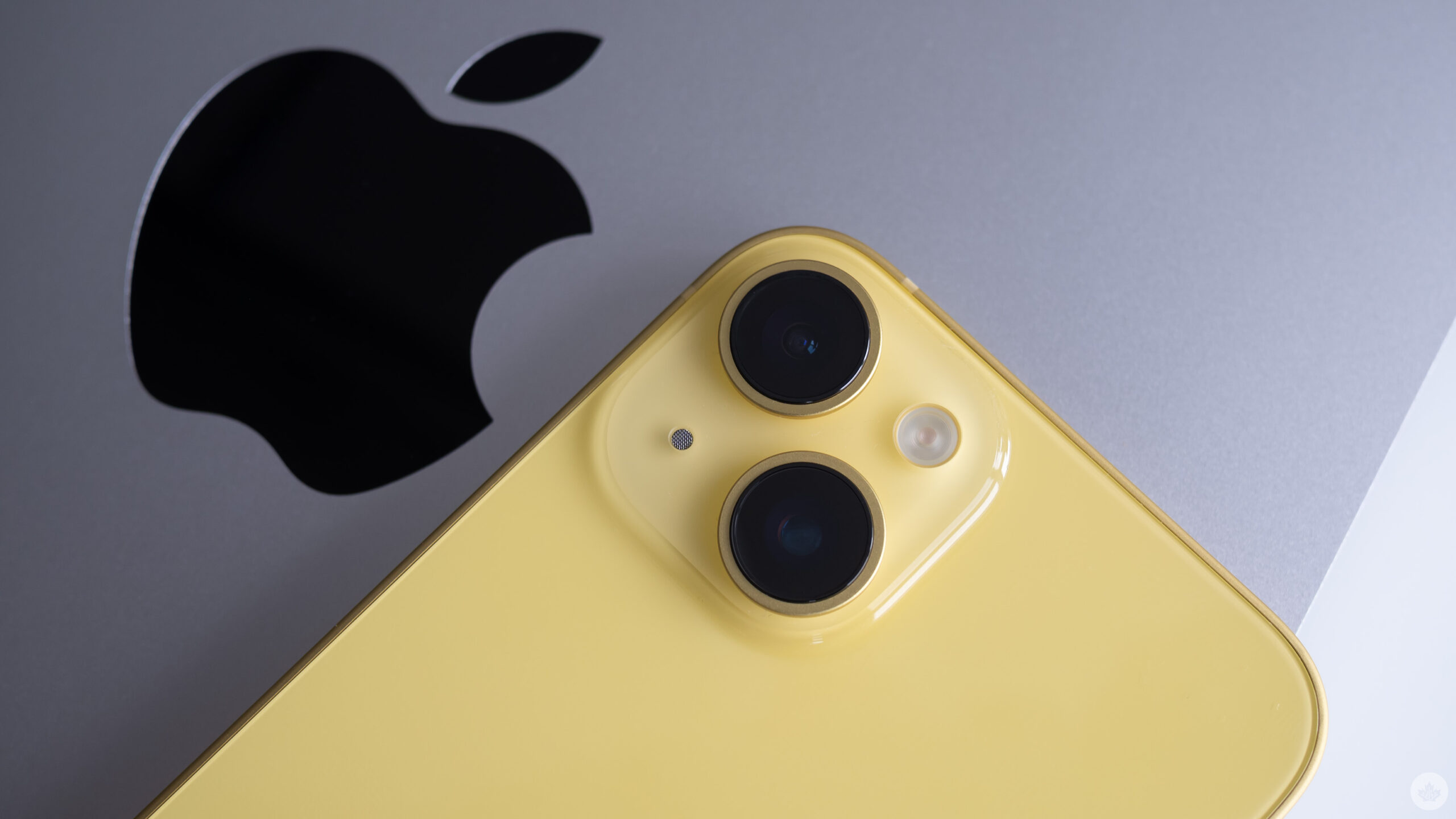 Yellow iPhone and Apple logo