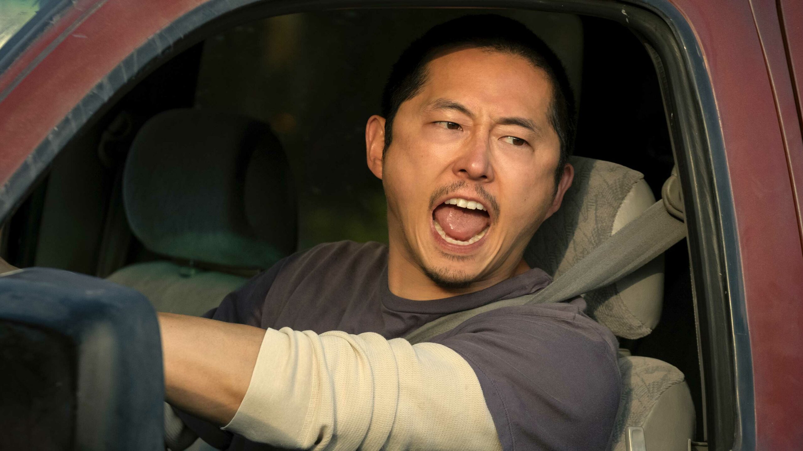 Steven Yeun yelling in a car in Beef on Netflix