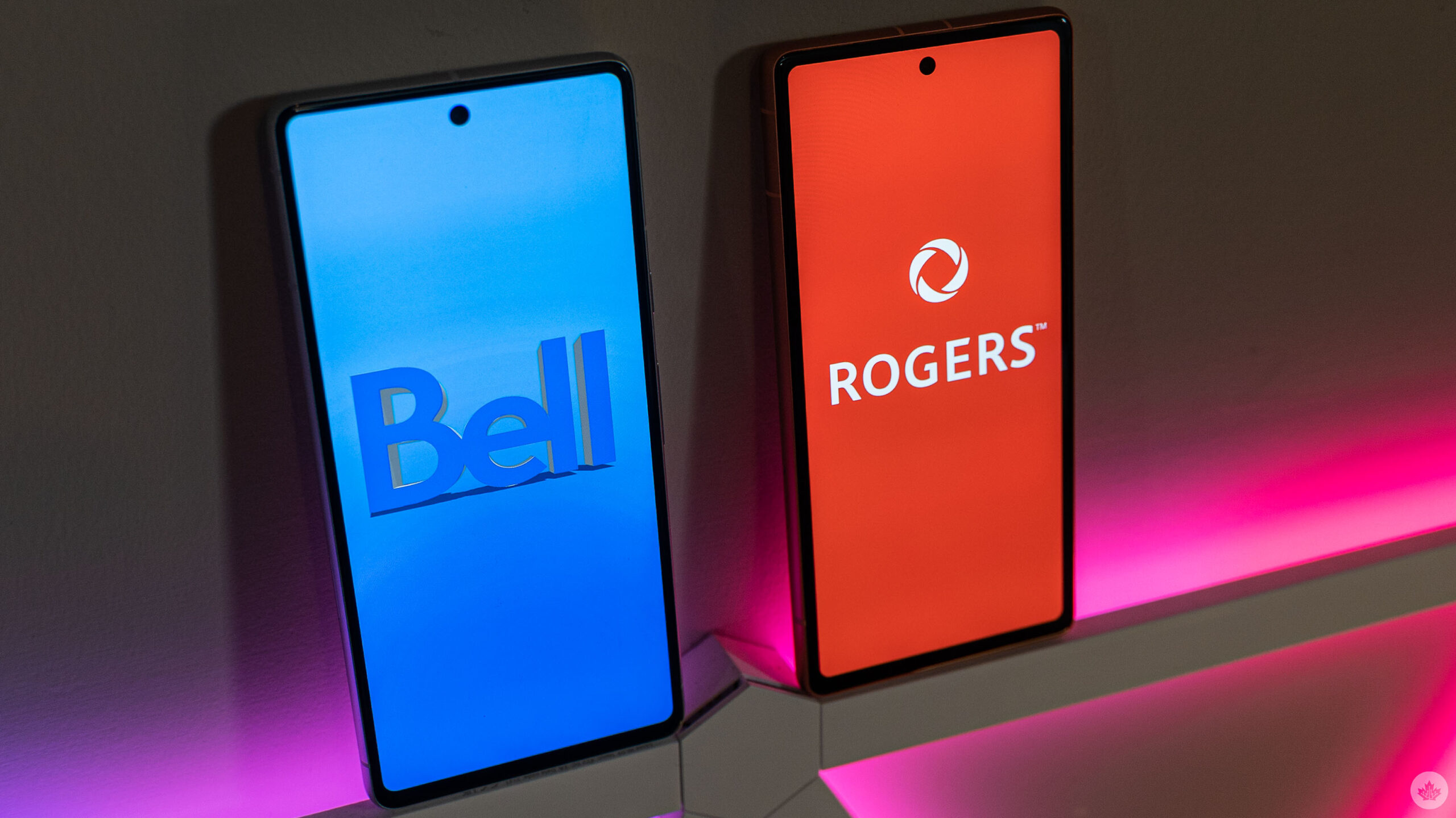 Bell and Rogers logos on smartphones.