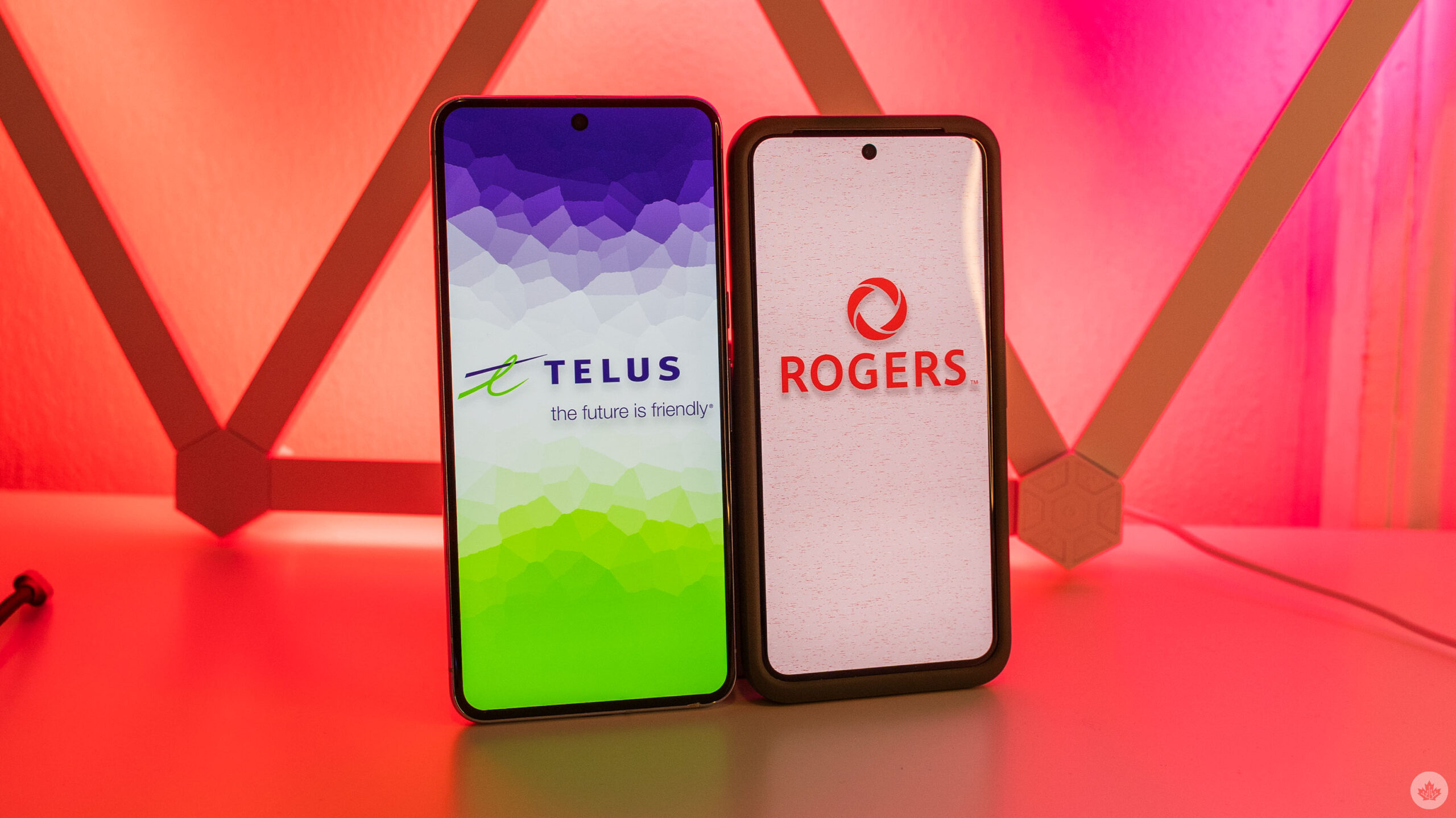 Telus and Rogers logos on smartphones.